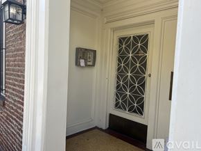 Los Angeles apartment for rent - A white door with a glass window and a metal grill design.