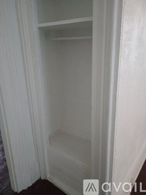 Pittsburgh apartment for rent - A white closet with a shelf and a white curtain.