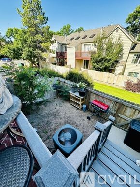 Aurora house for rent - A backyard with a hot tub and a deck.