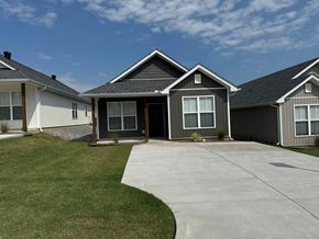 Little Rock house for rent - A house with a grey roof and a grey garage door.