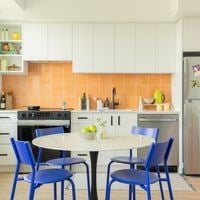 Victoria apartment for rent - A kitchen with a table and chairs.