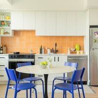 Victoria apartment for rent - A kitchen with a table and chairs.