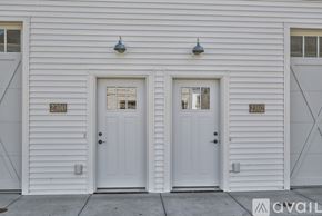 North Mankato townhouse for rent - Two white doors with numbers 2300 and 2302 on the wall.