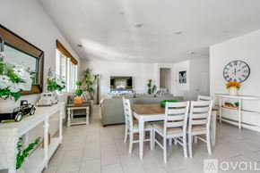 Indio house for rent - A white dining room with a table set for four.