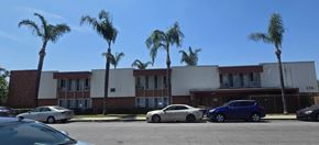 Pomona multi-family for rent - A building surrounded by palm trees