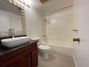Kapolei apartment for rent - A bathroom with a sink, toilet, and bathtub.