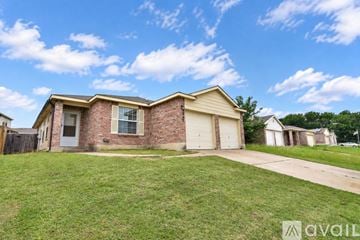 Killeen house for rent - A kitchen with wooden cabinets and stainless steel appliances.