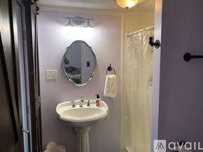 Hillsboro apartment for rent - A bathroom with a sink, mirror, and towel rack.