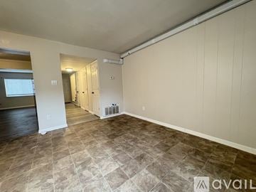 Virginia Beach house for rent - A kitchen with a black fridge and stainless steel appliances.