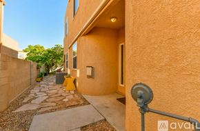 Albuquerque house for rent - A dog is sitting in a dog bed in front of a Christmas tree.