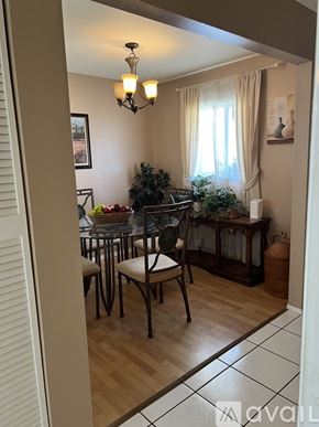 Sarasota condo for rent - A dining room with a table set for four.