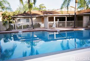 Sarasota condo for rent - A house with a pool in front of it.