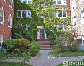 Brookline apartment for rent - A building with a green plant on the side of it.