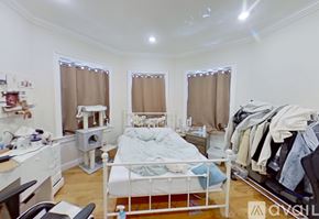 Boston apartment for rent - A bedroom with a bed, desk, and chair.