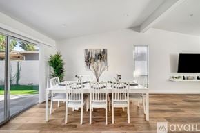 West Hills house for rent - A dining room with a white table and chairs.