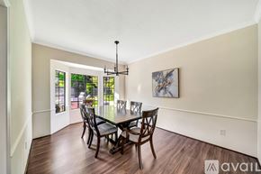 Agoura Hills house for rent - A dining room with a wooden table and chairs.
