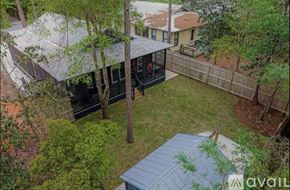 Santa Rosa Beach house for rent - A backyard with a deck and a hot tub.