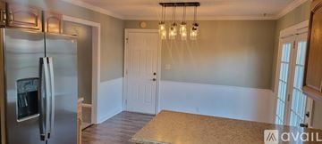 Clarksville house for rent - A kitchen with a bar and stools.