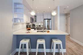 Vancouver apartment for rent - A kitchen with a bar stool in front of the counter.