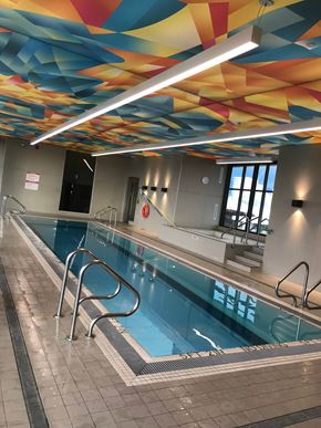 Vancouver apartment for rent - A swimming pool with a colorful ceiling.
