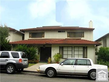 Newport Beach apartment for rent - A white car is parked in front of a house.