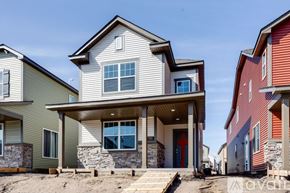 Ramsey house for rent - A modern house with a stone pillar in front.