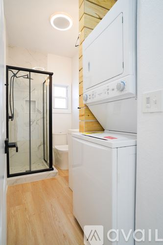 Kansas City house for rent - A white oven and dishwasher in a modern kitchen.