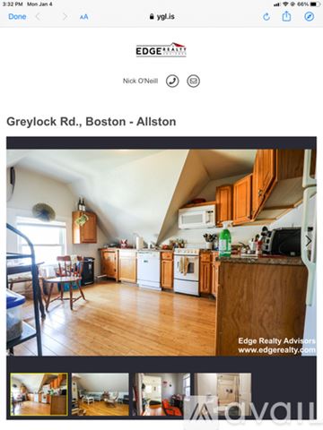 Boston apartment for rent - A kitchen with wooden cabinets and a white refrigerator.