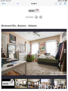 Boston apartment for rent - A bedroom with a bed, desk, and a window with white curtains.