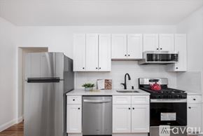 Boston apartment for rent - A kitchen with white cabinets and appliances.