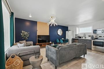 Dallas apartment for rent - A modern living room with a grey couch and a grey sofa.
