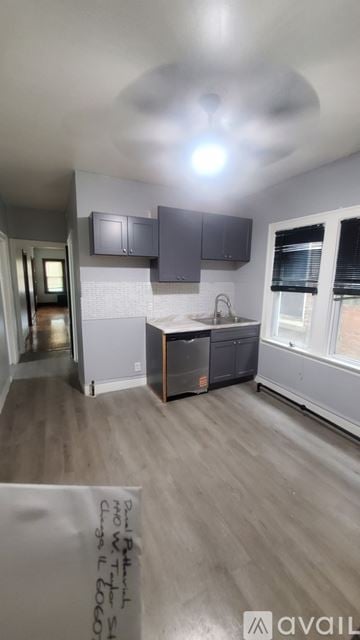 Chicago house for rent - A kitchen with a sink and a window.