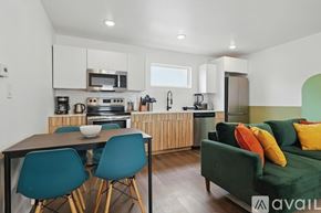 Dallas apartment for rent - A kitchen with a table and chairs in front of it.