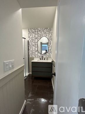 Ontario townhouse for rent - A bathroom with a mirror and a sink.