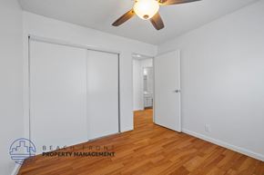 Los Angeles apartment for rent - A room with a ceiling fan and wooden floors.