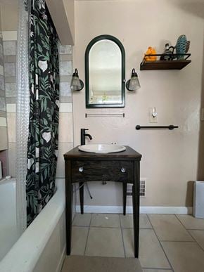Greensburg house for rent - A bathroom with a sink and a mirror.