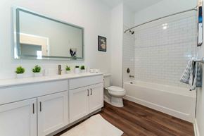 Bound Brook apartment for rent - A white bathroom with a white toilet and a white bathtub.