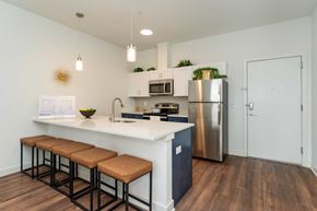Bound Brook apartment for rent - A kitchen with a white countertop and a stainless steel refrigerator.