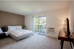 San Jose apartment for rent - A bedroom with a bed, a couch, a window, and a television.