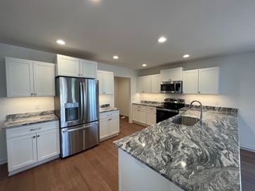 Belgium apartment for rent - A kitchen with granite countertops and stainless steel appliances.