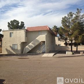 Las Vegas apartment for rent - A house with a red tile roof and a staircase leading to the entrance.