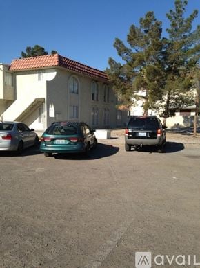 Las Vegas apartment for rent - A car is parked in a lot in front of a house.