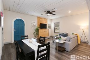San Antonio house for rent - A dining room with a black table and chairs.