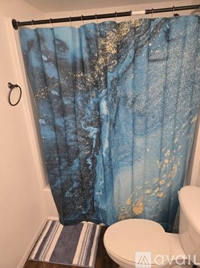 Phoenix condo for rent - A view from inside a room looking out onto a balcony with a wooden railing.