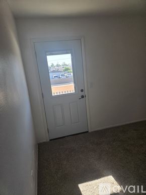 Phoenix condo for rent - A white door with a window in the middle of a room.