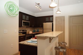 Modern kitchens with stand-alone islands and breakfast bars