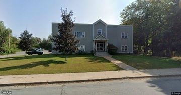 Windsor apartment for rent - A grey house with a white door and windows.