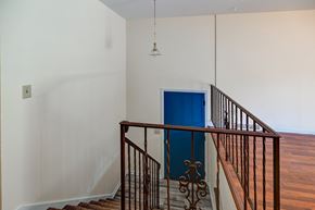 Madison house for rent - A blue door is on the stairs.