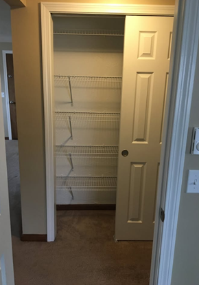 Athol apartment for rent - A white door with a shelf underneath it.