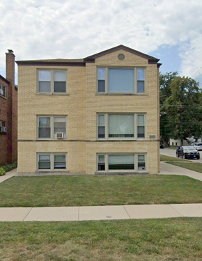 Elmwood Park apartment for rent - A brick building with a green lawn in front.